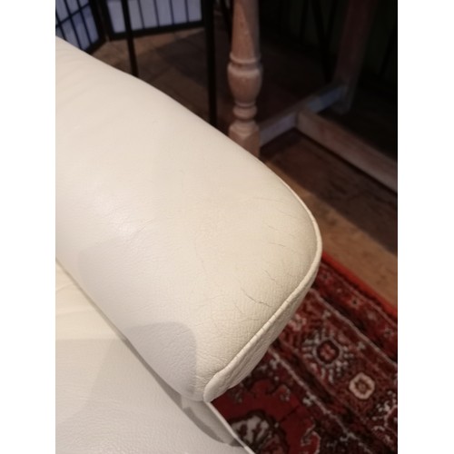 831 - An Ekornes Stressless cream leather armchair, late 20th/early 21st century, with a reclining and swi... 