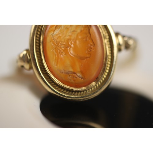 253 - An 18th century intaglio ring, the oval intaglio depicting a Roman Emperor, in profile, facing dexte... 