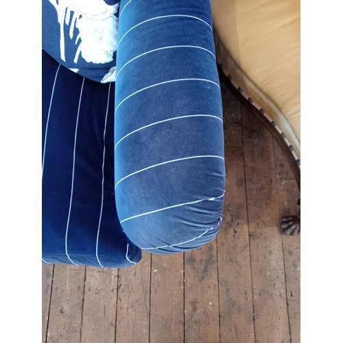 862 - A Tetrad 'Gatsby' sofa in Ralph Lauren striped blue fabric, upon turned hardwood legs, with five ass... 