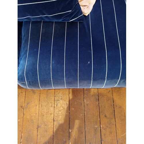 862 - A Tetrad 'Gatsby' sofa in Ralph Lauren striped blue fabric, upon turned hardwood legs, with five ass... 