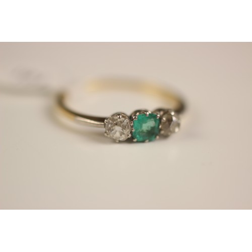 161 - An early 20th century emerald and diamond three stone ring, the central square cut emerald with an o... 