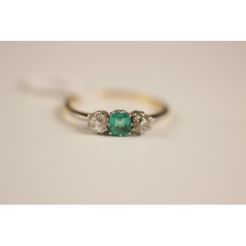 161 - An early 20th century emerald and diamond three stone ring, the central square cut emerald with an o... 