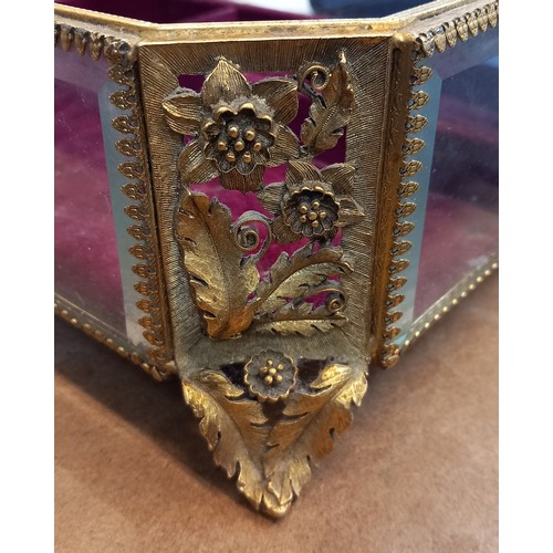 279 - An ormolu filigree jewellery casket, 20th century, of rectangular form with canted corners, with bev... 