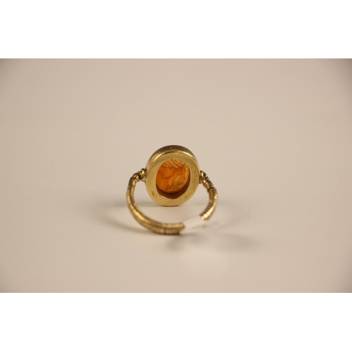 253 - An 18th century intaglio ring, the oval intaglio depicting a Roman Emperor, in profile, facing dexte... 