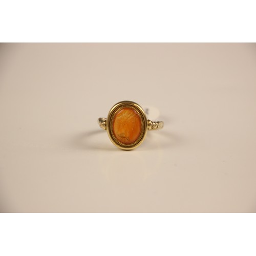 253 - An 18th century intaglio ring, the oval intaglio depicting a Roman Emperor, in profile, facing dexte... 