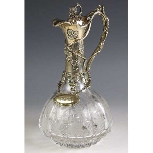 100 - A 20th century silver plated claret jug, the thumbpiece designed as a bunch of grapes, leading to al... 