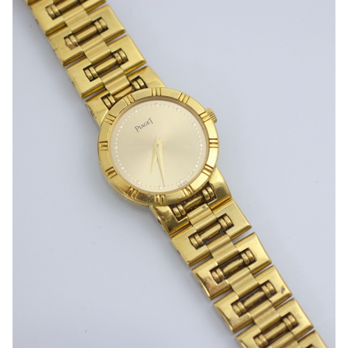 123 - A ladies Piaget 18ct yellow gold wristwatch, the circular gold coloured dial with dotted markers, se... 