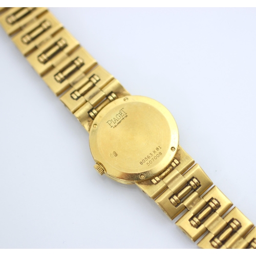 123 - A ladies Piaget 18ct yellow gold wristwatch, the circular gold coloured dial with dotted markers, se... 