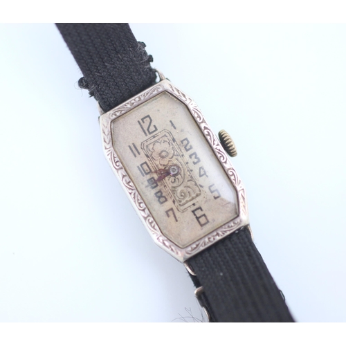 124 - An early 20th century silver cocktail watch, possibly French, the rectangular dial with canted corne... 