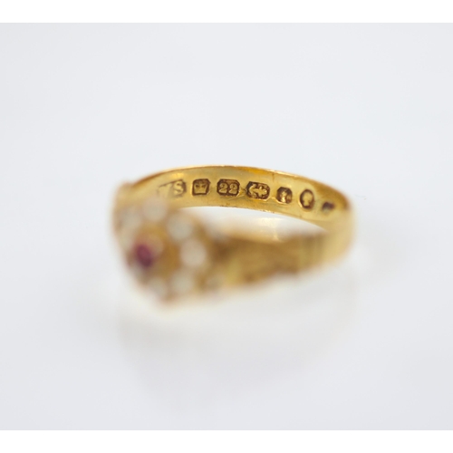 167 - A Victorian 22ct yellow metal split pearl ring, the central round red stone within a surround of eig... 