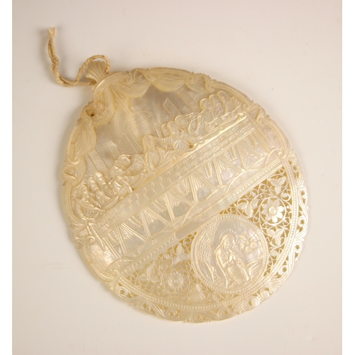 249 - A mother of pearl carved abalone shell, early 20th century, the top section relief carved after Leon... 