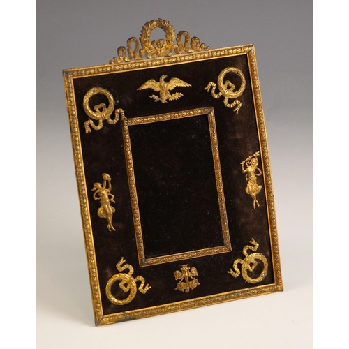 258 - A French Empire style gilt metal mounted frame, late 19th or early 20th century, the gilt metal bord... 