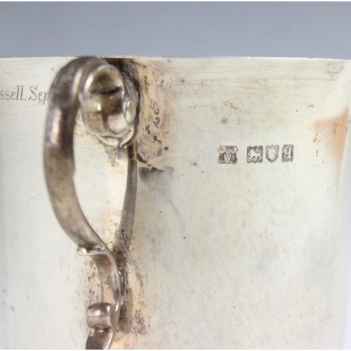 1 - A George V silver twin handled cup, D & J Wellby Ltd, London 1911, the scroll handles above flared r... 