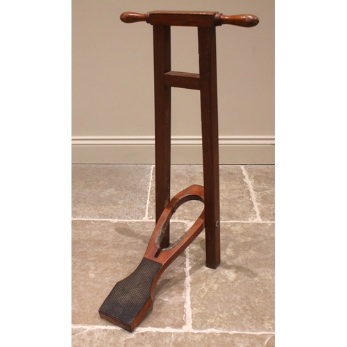 659 - A free standing mahogany boot jack, early 20th century, with turned handles upon the square section ... 