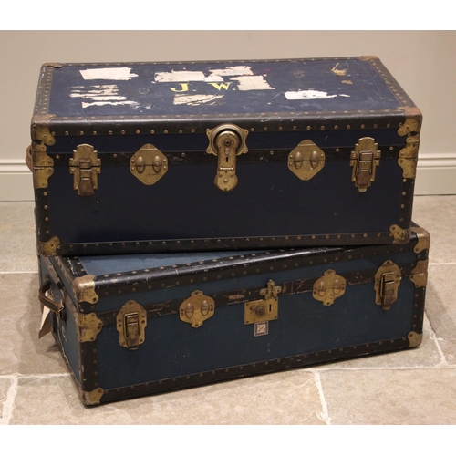 667 - A blue canvas steamer/travel trunk, early 20th century, applied with metal corner brackets and bandi... 