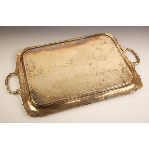 67 - A George V silver tray, L Harrison, Sheffield 1931, the shaped twin handled tray with shell shaped c... 