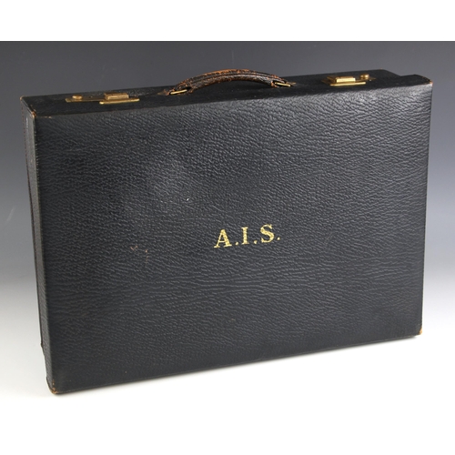 670 - A leather vanity case by G.J.H. Brown and Son Ltd, 20th century, the navy blue case with silk lined ... 