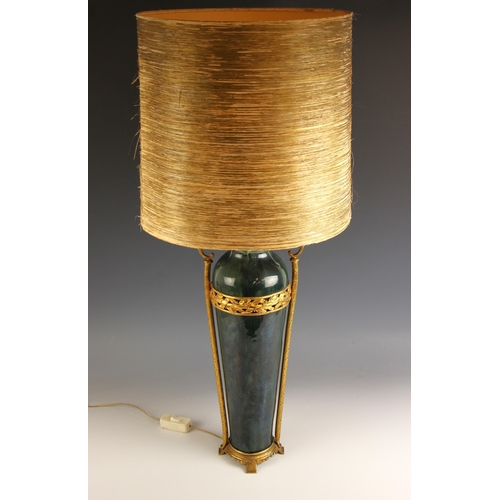 679 - A modern neoclassical-style pottery and gilt metal table lamp, the mottled green glazed body set wit... 