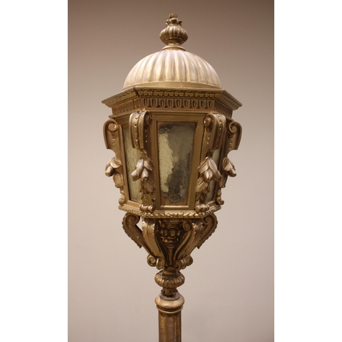 695 - A giltwood standard lamp/lantern, early 20th century, the lantern of hexagonal form with a domed cov... 