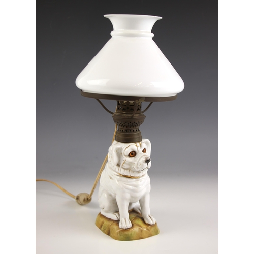 696 - A table lamp, late 19th century/early 20th century, the base modelled as a porcelain dog, with glass... 