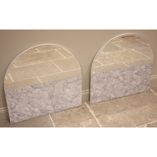 703 - A pair of Carrera marble mirrored splash backs, early 21st century, each with a demi lune bevelled m... 