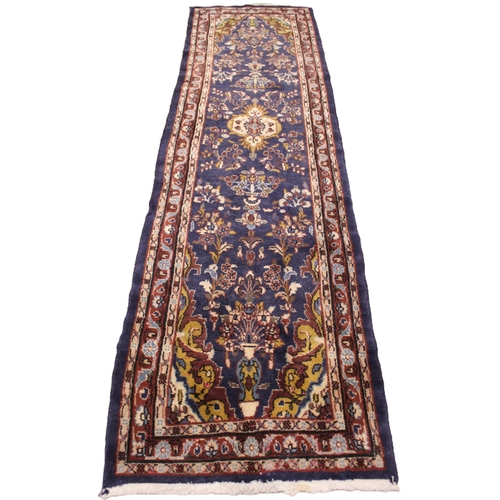 728 - A small full pile rich blue ground Persian Sarook runner, the central ogee medallion within an all o... 