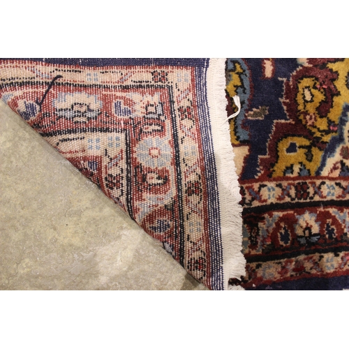 728 - A small full pile rich blue ground Persian Sarook runner, the central ogee medallion within an all o... 