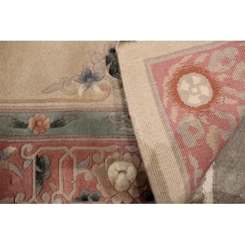 732 - A Chinese thick pile wool rug, the central foliate and shou symbol medallion upon a mushroom coloure... 