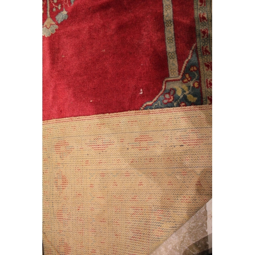 735 - A Persian bamboo silk prayer rug, the central red field with a foliate urn, flanked by vertical colu... 