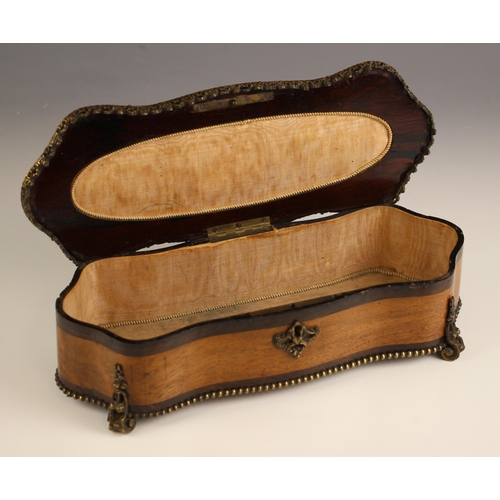 743 - A French walnut and rosewood serpentine jewellery casket, mid-19th century, the hinged cover applied... 