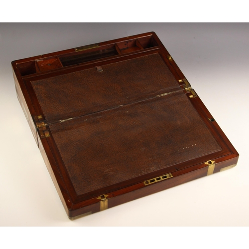 745 - A 19th century mahogany brass bound stationery box, applied with a shaped brass cartouche, banding, ... 