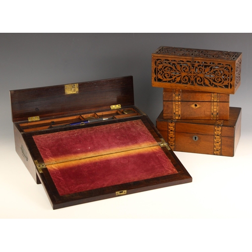 748 - A mid 19th century rosewood and brass inlaid writing slope, opening to a velour writing surface and ... 