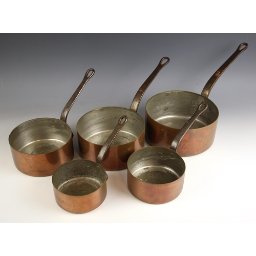 755 - A graduated set of five copper saucepans, of typical form, the steel handles with pierced hanging lo... 