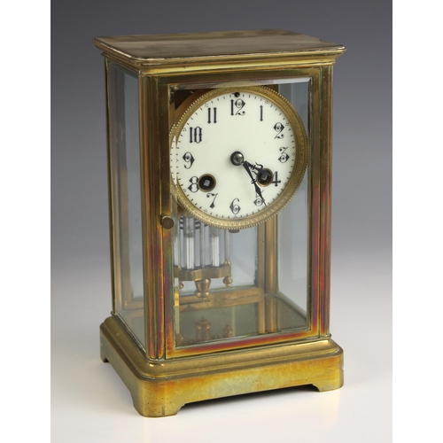 766 - A French four glass mantel clock, early 20th century, the bevelled glass case enclosing a 9cm dial a... 