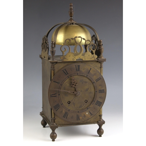 770 - A Charles II style brass lantern form mantel clock, the 18cm dial applied with Roman numerals enclos... 