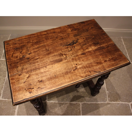 781 - An early 18th century walnut side table, the rectangular moulded top over a single frieze drawer, up... 