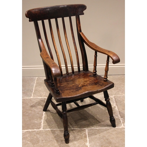 785 - A 19th century Welsh primitive ash Windsor chair, probably Brecon region, the curved lath back over ... 