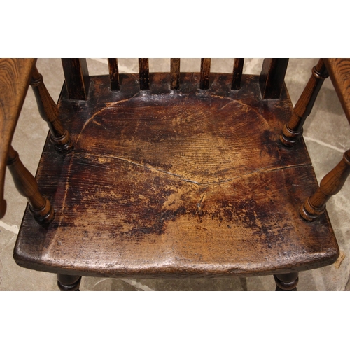 785 - A 19th century Welsh primitive ash Windsor chair, probably Brecon region, the curved lath back over ... 