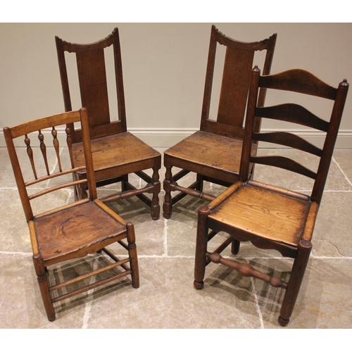 787 - A pair of 18th century oak hall chairs, each with a splat back over a board seat upon baluster and b... 