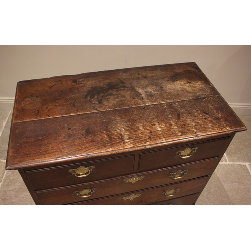 790 - An early 18th century oak chest of drawers, the twin plank moulded top over an arrangement of two sh... 