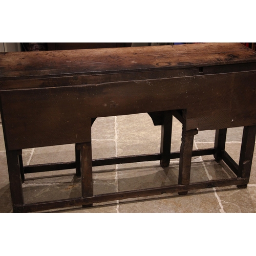 792 - An 18th century oak dresser, the open plate rack with a moulded cornice and plain frieze over three ... 