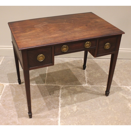 797 - A George III mahogany low boy/side table, of cottage proportions, the rectangular moulded top over a... 