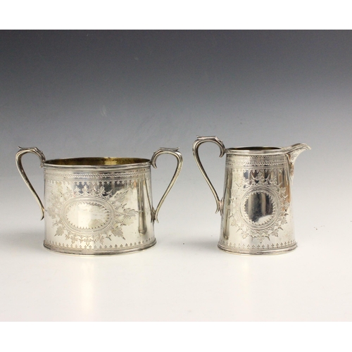 80 - A Victorian silver twin handled sugar bowl and milk jug, John, Edward, Walter & John Barnard, London... 