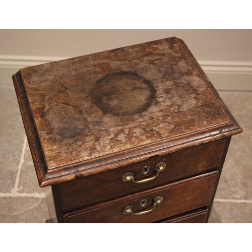 801 - A George III mahogany pedestal chest, the rectangular moulded top over four graduated and lip moulde... 