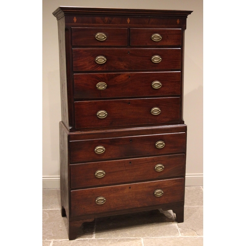 805 - A George III mahogany chest on chest, the moulded cornice over a frieze inlaid with satinwood lozeng... 