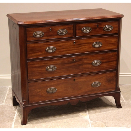 806 - An early 19th century mahogany chest of drawers, the rectangular moulded top with canted front corne... 