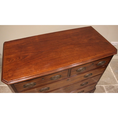 806 - An early 19th century mahogany chest of drawers, the rectangular moulded top with canted front corne... 