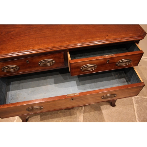 806 - An early 19th century mahogany chest of drawers, the rectangular moulded top with canted front corne... 