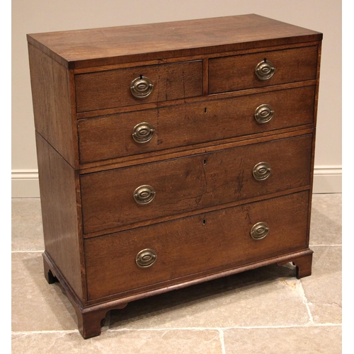 811 - A late George III oak twin section chest of drawers, formed with two short over three long graduated... 