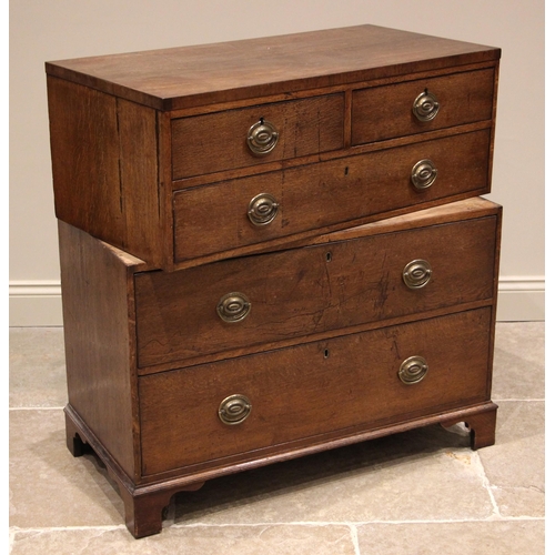 811 - A late George III oak twin section chest of drawers, formed with two short over three long graduated... 